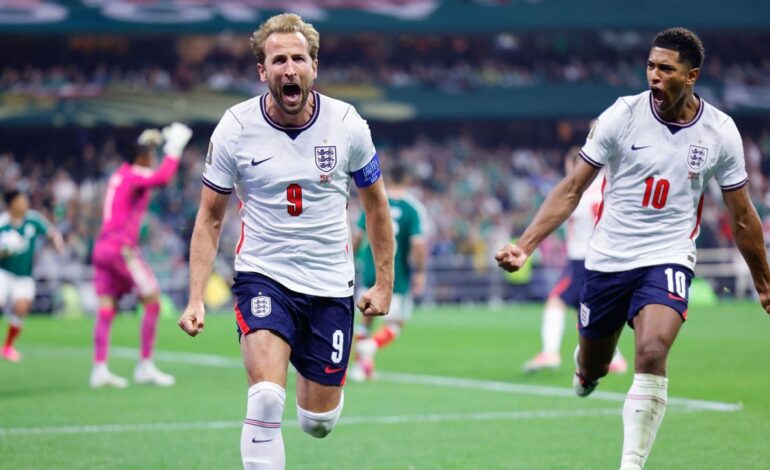 Harry Kane celebrates after scoring as Jude Bellingham joins during England's 3-2 victory over Mexico in the FIFA World Cup 2026 Round of 16.
